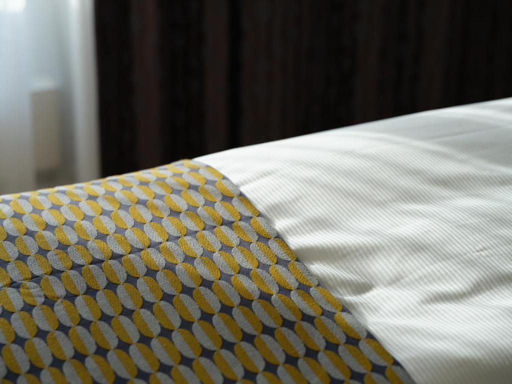 Postel nebo postele na pokoji v ubytování Hotel Berchtold