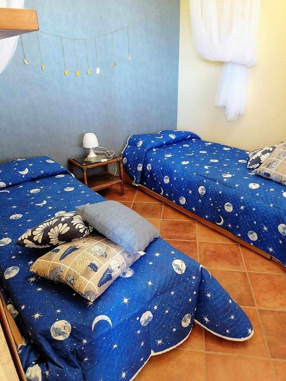 Łóżko lub łóżka w pokoju w obiekcie Uva & Stelle Maison in collina di Sperlonga