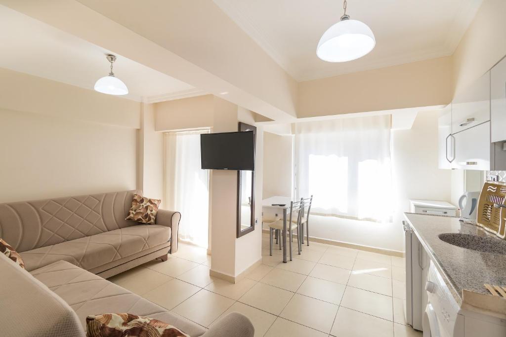 A kitchen or kitchenette at Apartments Near to City Center and Beach
