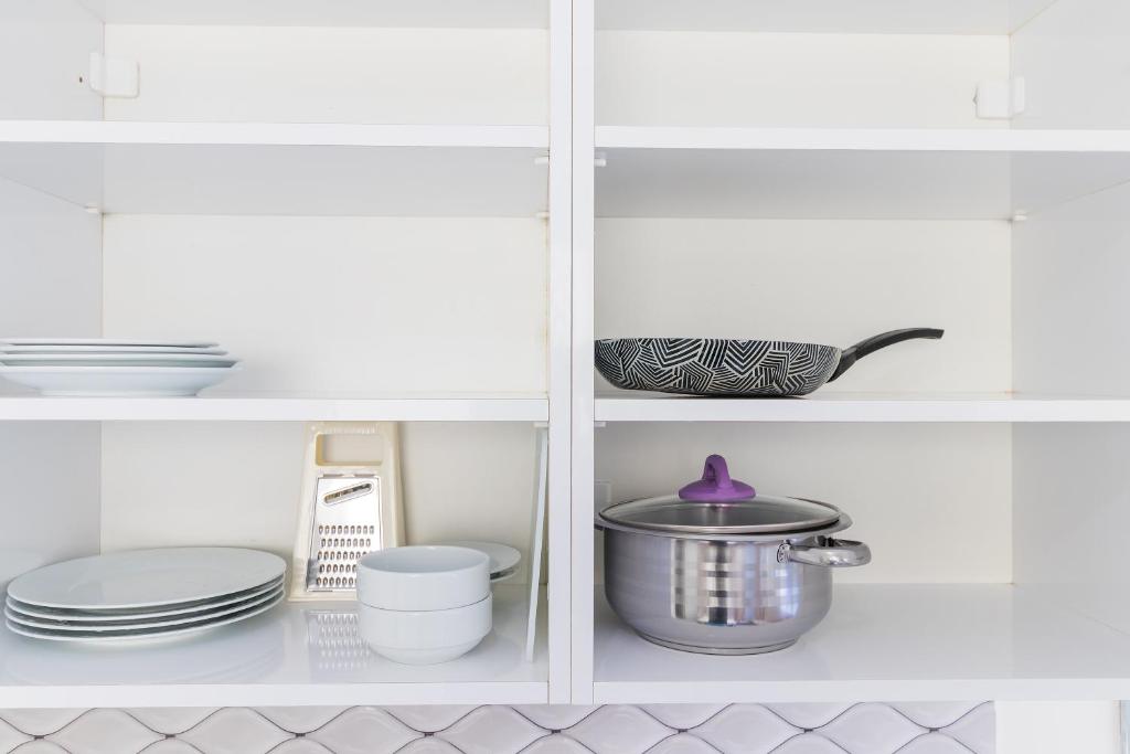 A kitchen or kitchenette at Apartments Near to City Center and Beach