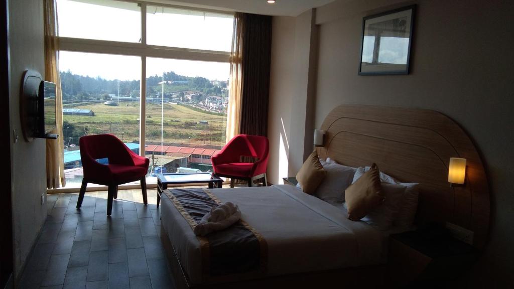 Posezení v ubytování Mango Hill Central Ooty