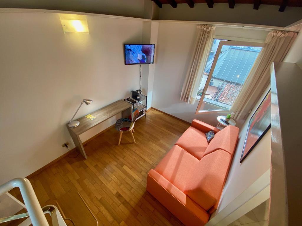 Televízia a/alebo spoločenská miestnosť v ubytovaní Corso Double
