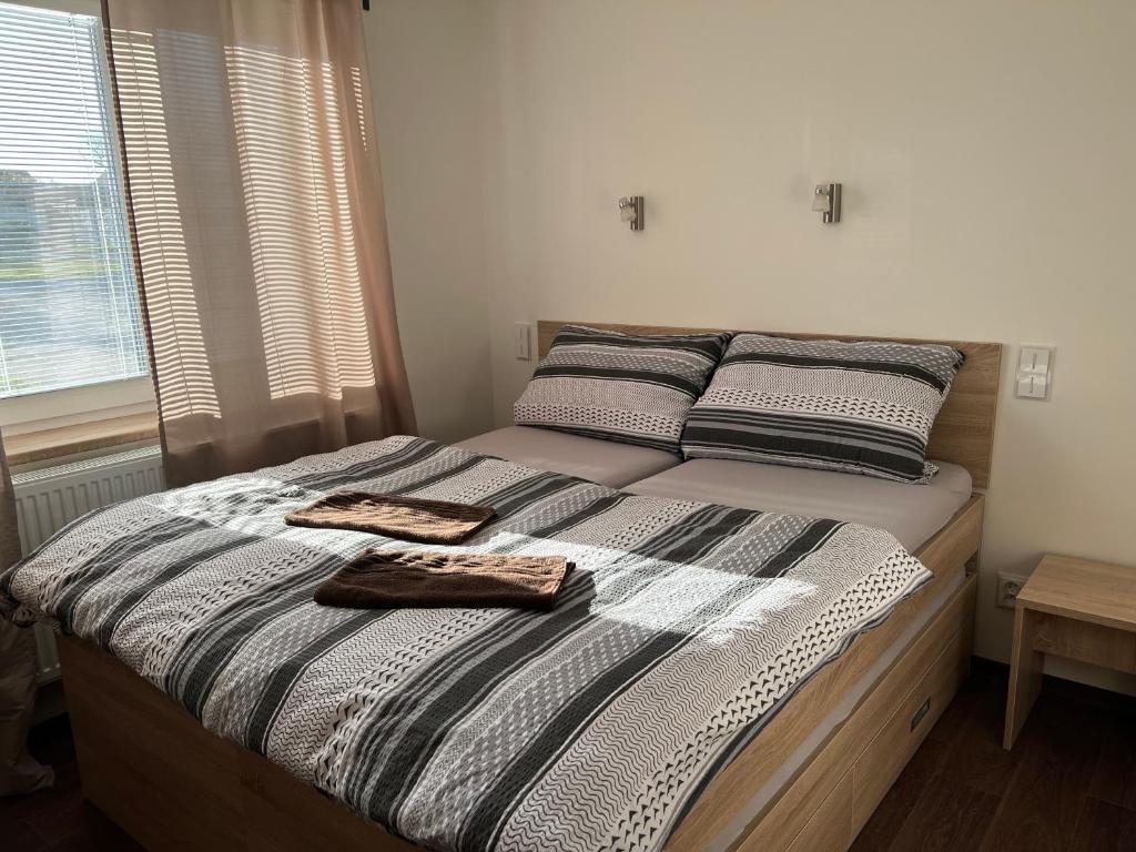 Postel nebo postele na pokoji v ubytování Penzion Na Rozcestí