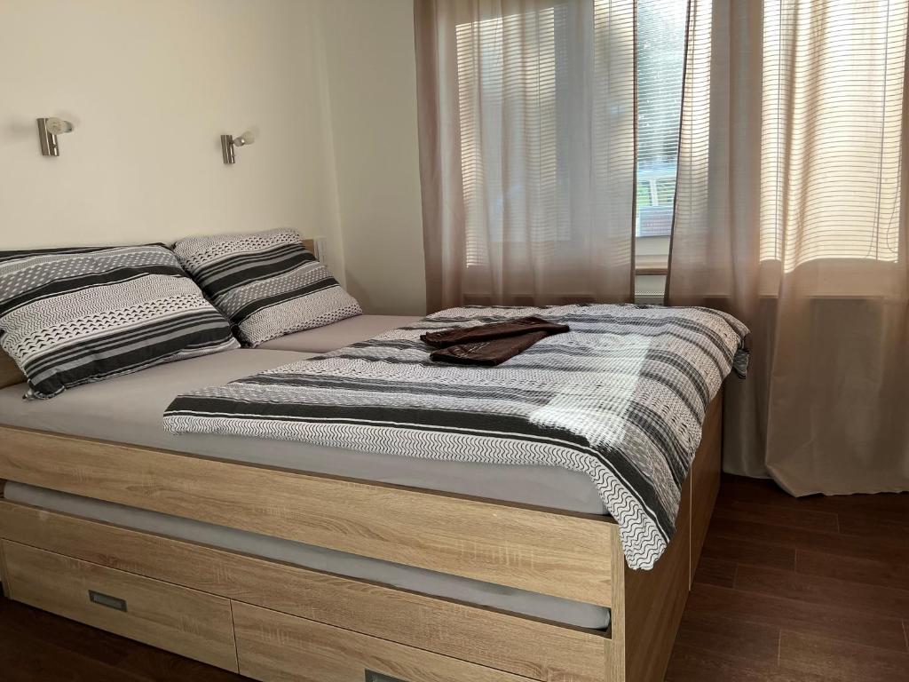 Postel nebo postele na pokoji v ubytování Penzion Na Rozcestí