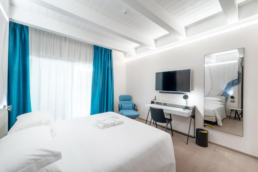 Postel nebo postele na pokoji v ubytování Hotel Veronesi La Torre