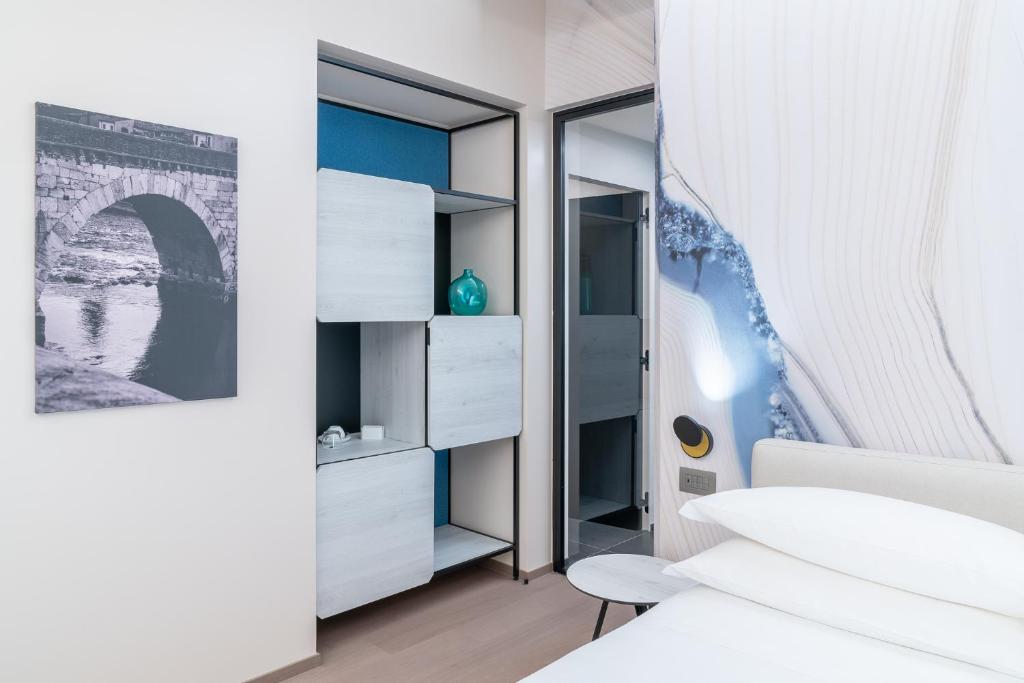 Postel nebo postele na pokoji v ubytování Hotel Veronesi La Torre