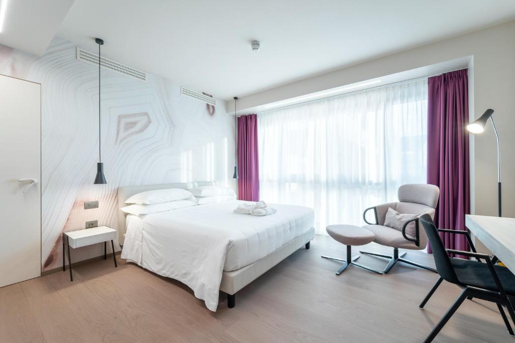 Postel nebo postele na pokoji v ubytování Hotel Veronesi La Torre