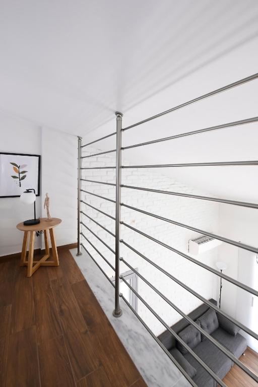 a room with metal railings and a table at AG Luxury Villas, Iraklitsa in Iraklitsa