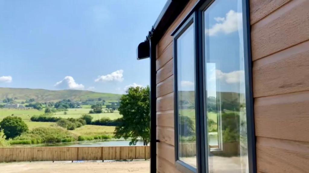 a view from the window of a house with a view at Lake View at Pendle View Holiday Park BB7 4DH in Clitheroe