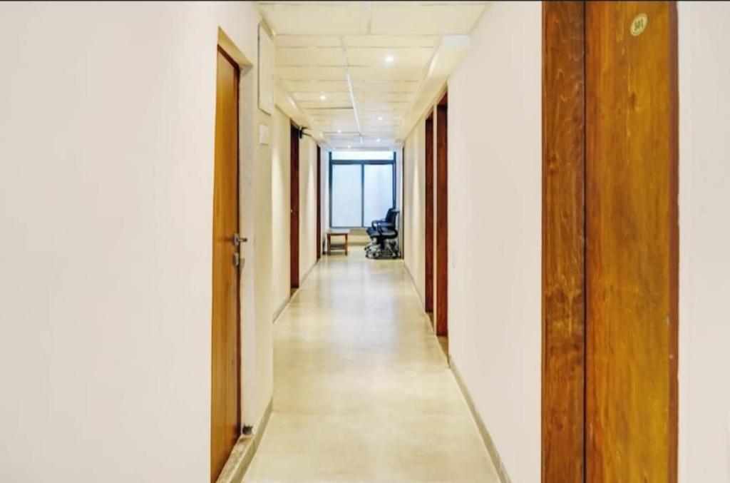 an empty corridor of an office with a long hallway at HOTEL V in Hyderabad