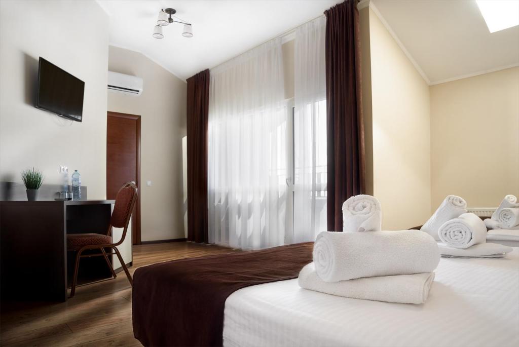 Postel nebo postele na pokoji v ubytování Complex Turistic Codru