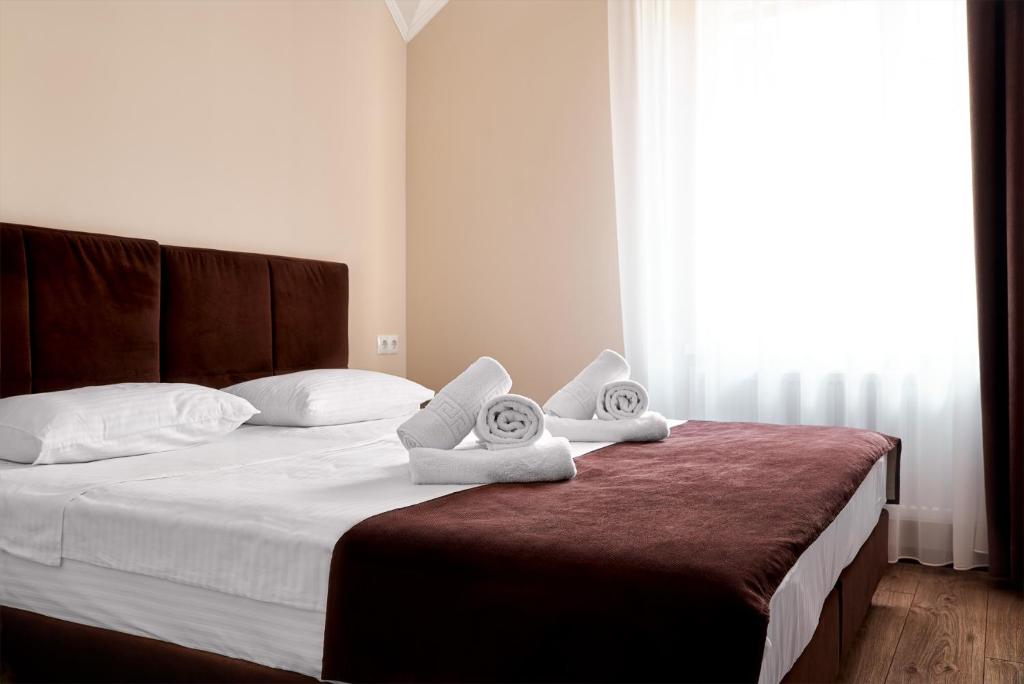 Postel nebo postele na pokoji v ubytování Complex Turistic Codru