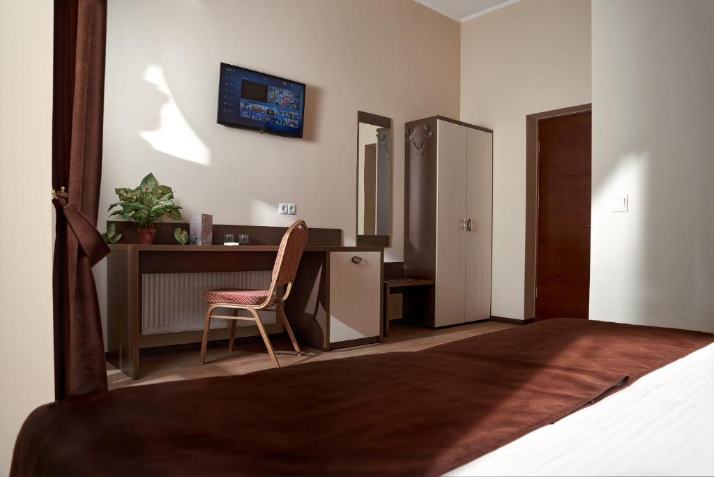 TV a/nebo společenská místnost v ubytování Complex Turistic Codru