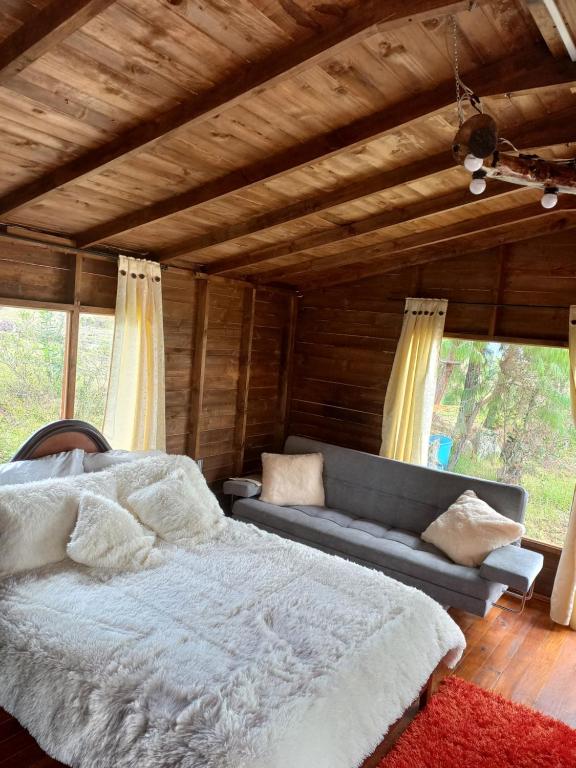 Posezení v ubytování Cabaña Sueños Dorados