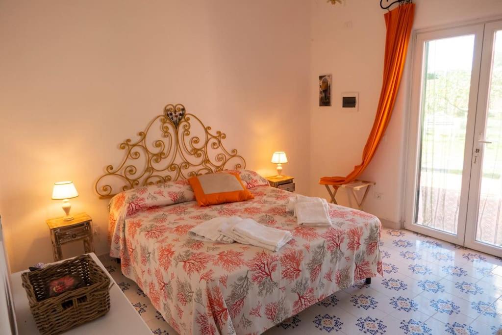 Postel nebo postele na pokoji v ubytování Villa Conchiglia blu con piscina