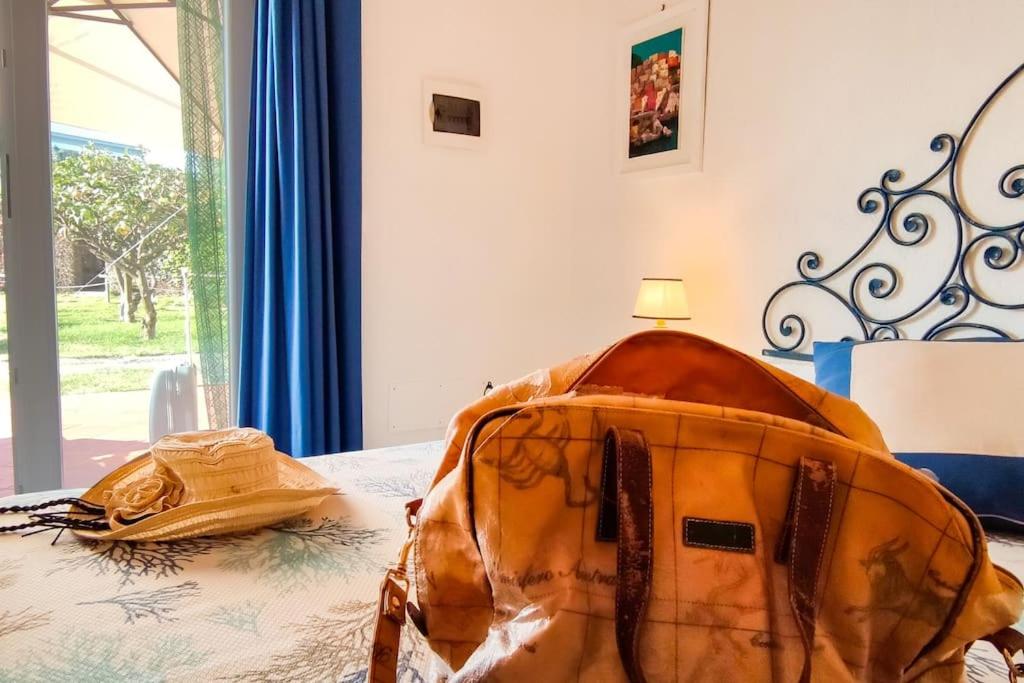 Postel nebo postele na pokoji v ubytování Villa Conchiglia blu con piscina