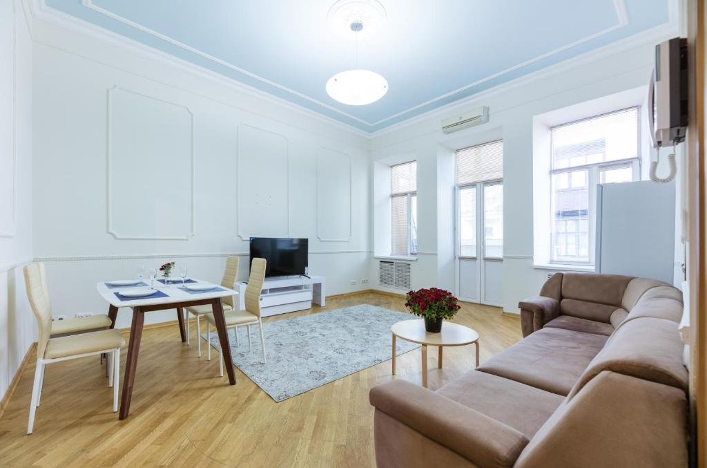a living room with a couch and a table at Квартира в центре Киева in Kyiv