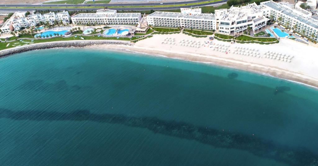 an aerial view of a beach and the ocean at Radisson Blu Resort, Fujairah in Dibba