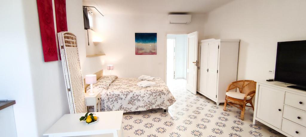 Postel nebo postele na pokoji v ubytování Villa Conchiglia blu con piscina