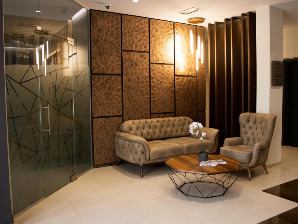 Posezení v ubytování NEW Garni Hotel FILIA