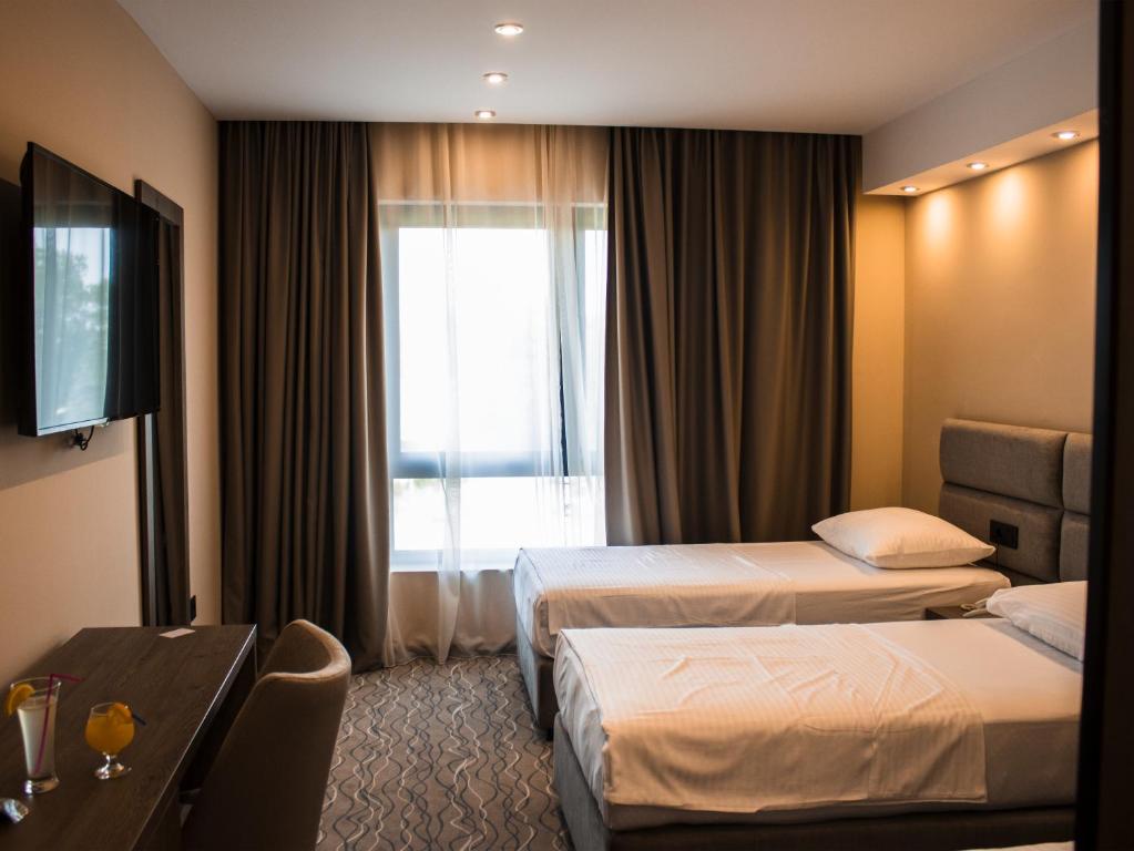 Postel nebo postele na pokoji v ubytování NEW Garni Hotel FILIA