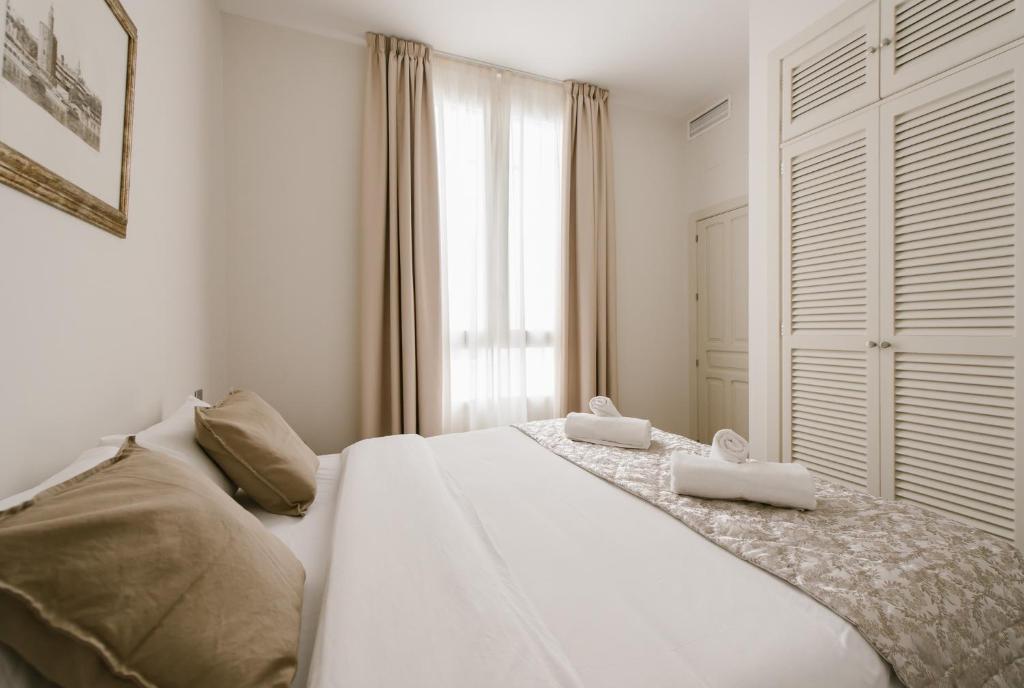 Postel nebo postele na pokoji v ubytování T1, Tirso de Molina, apartamento luminoso y tranquilo