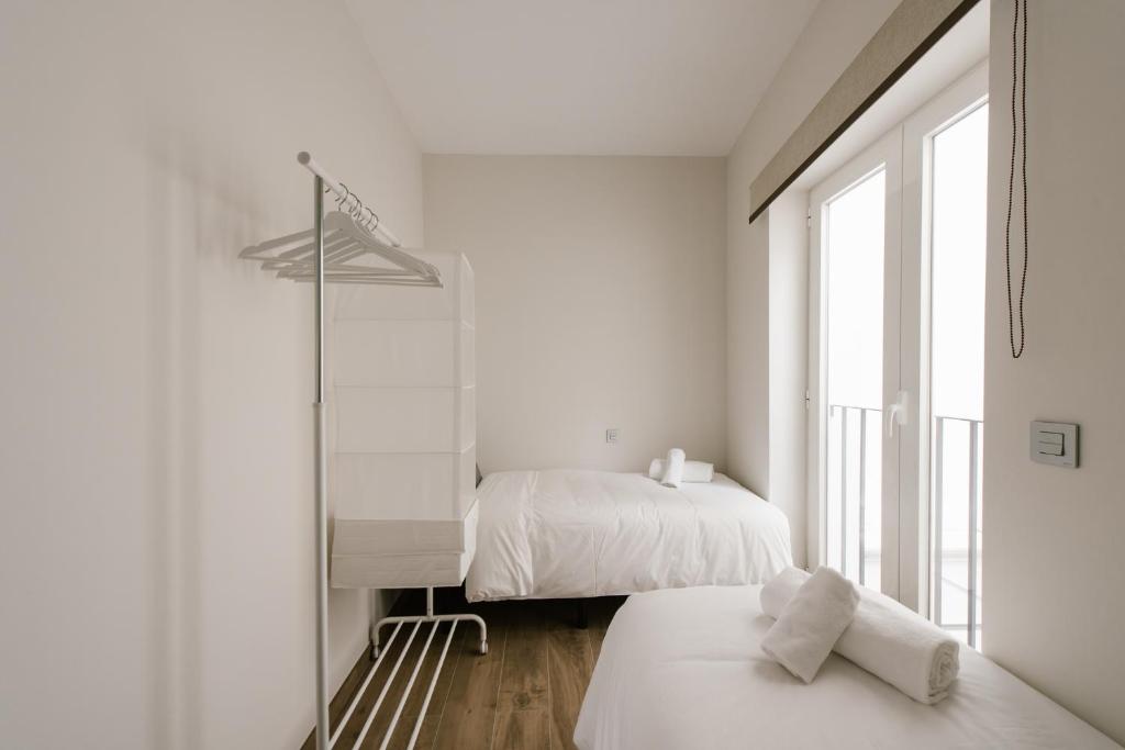 Postel nebo postele na pokoji v ubytování T1, Tirso de Molina, apartamento luminoso y tranquilo