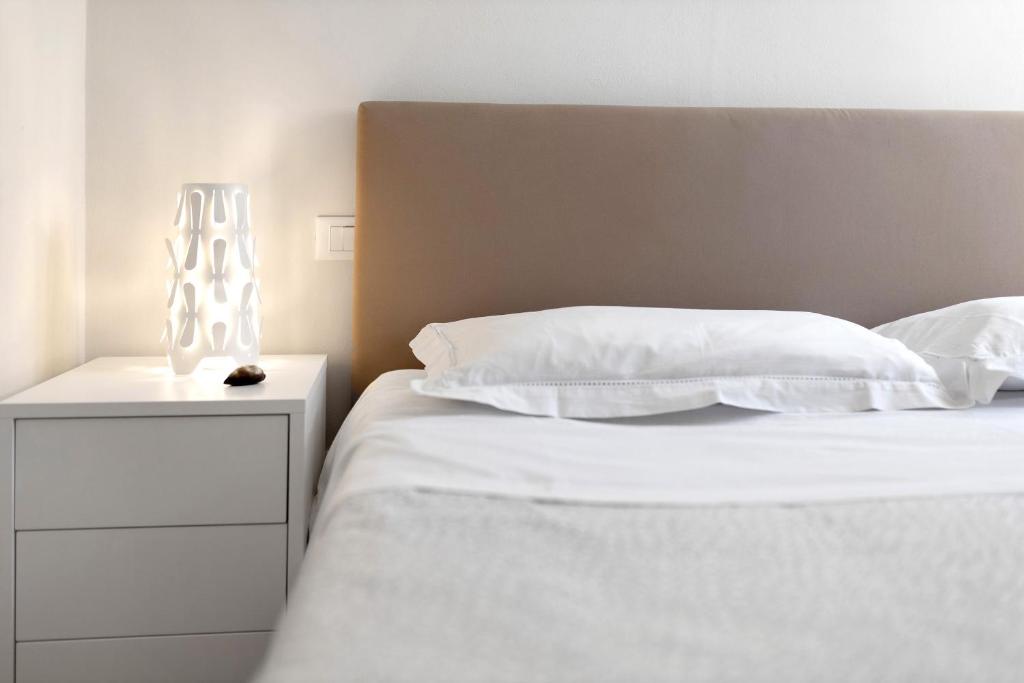 A bed or beds in a room at Bordighera weekend vacanze e mare