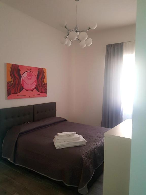 Łóżko lub łóżka w pokoju w obiekcie B&B Del Corso