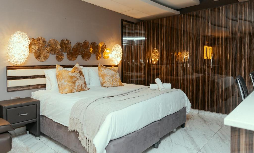 a bedroom with a large bed in a room at Monte La Vue Hotel in Sandton