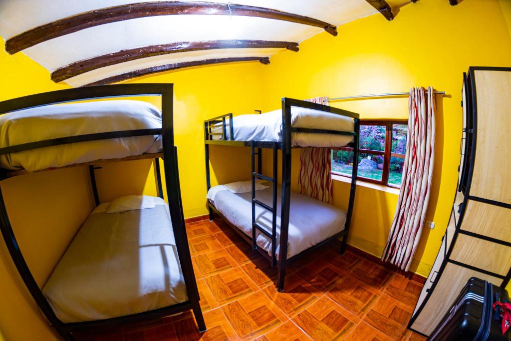 Postel nebo postele na pokoji v ubytování Happy Land Valle Sagrado