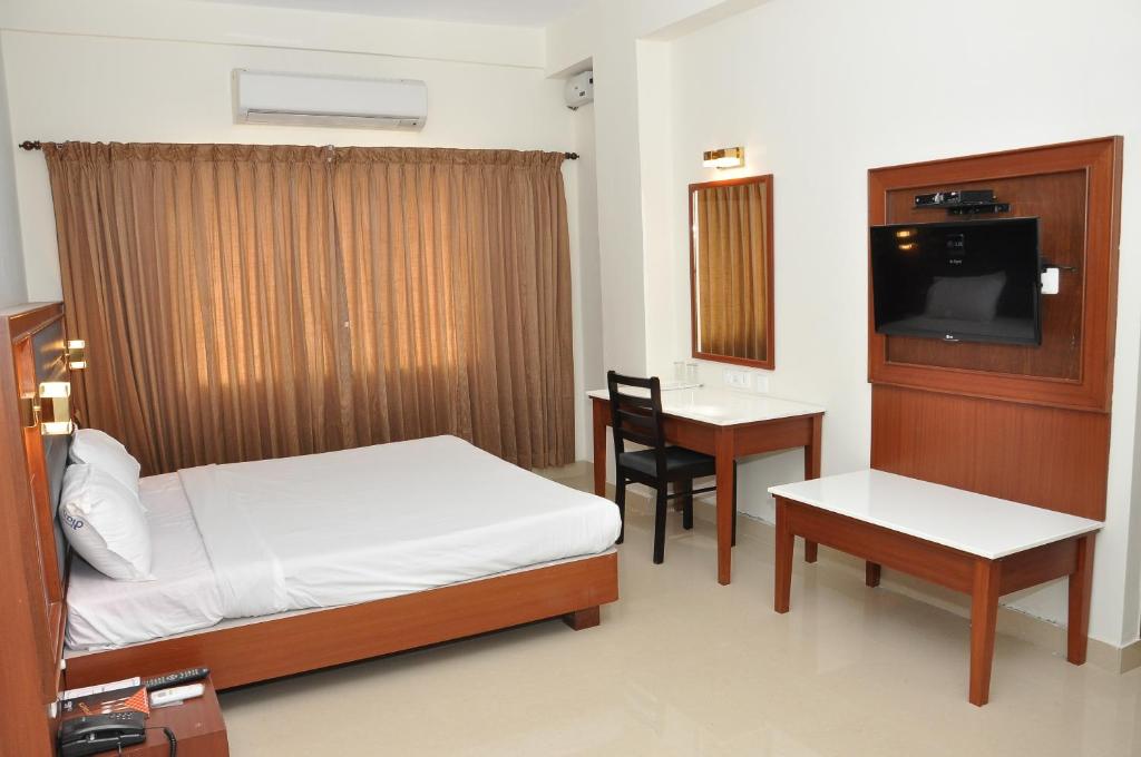 Postel nebo postele na pokoji v ubytování Hotel Royal Chambers