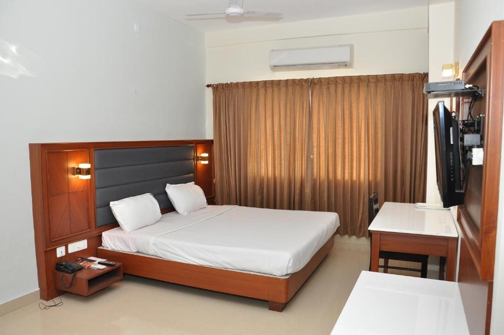 Ένα ή περισσότερα κρεβάτια σε δωμάτιο στο Hotel Royal Chambers