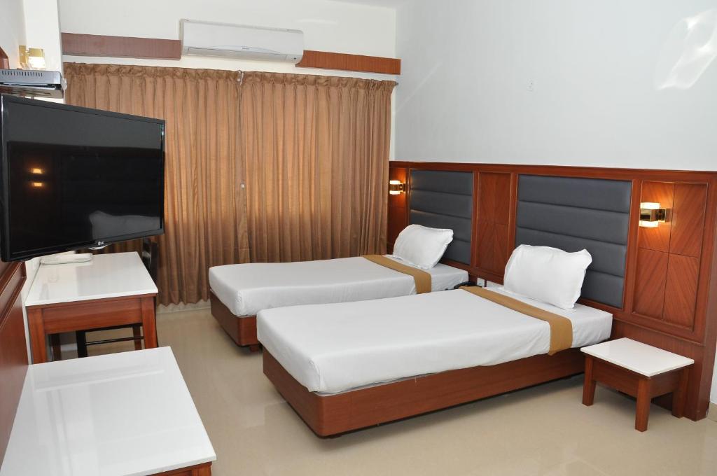 Postel nebo postele na pokoji v ubytování Hotel Royal Chambers