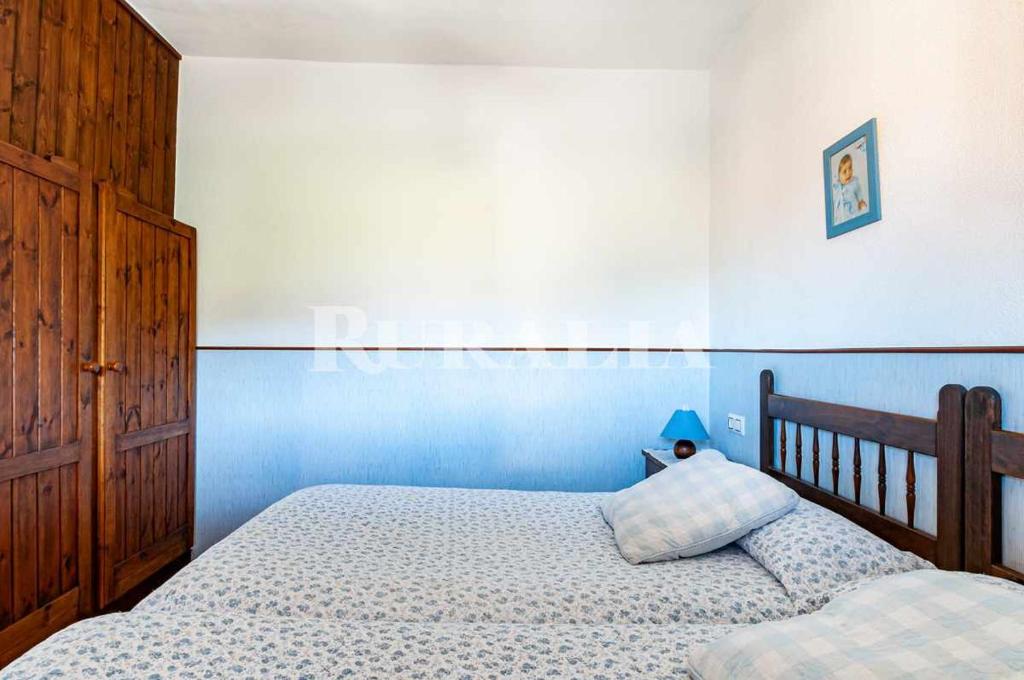 A bed or beds in a room at Casa Carmen 5 Situada en una zona muy tranquila a