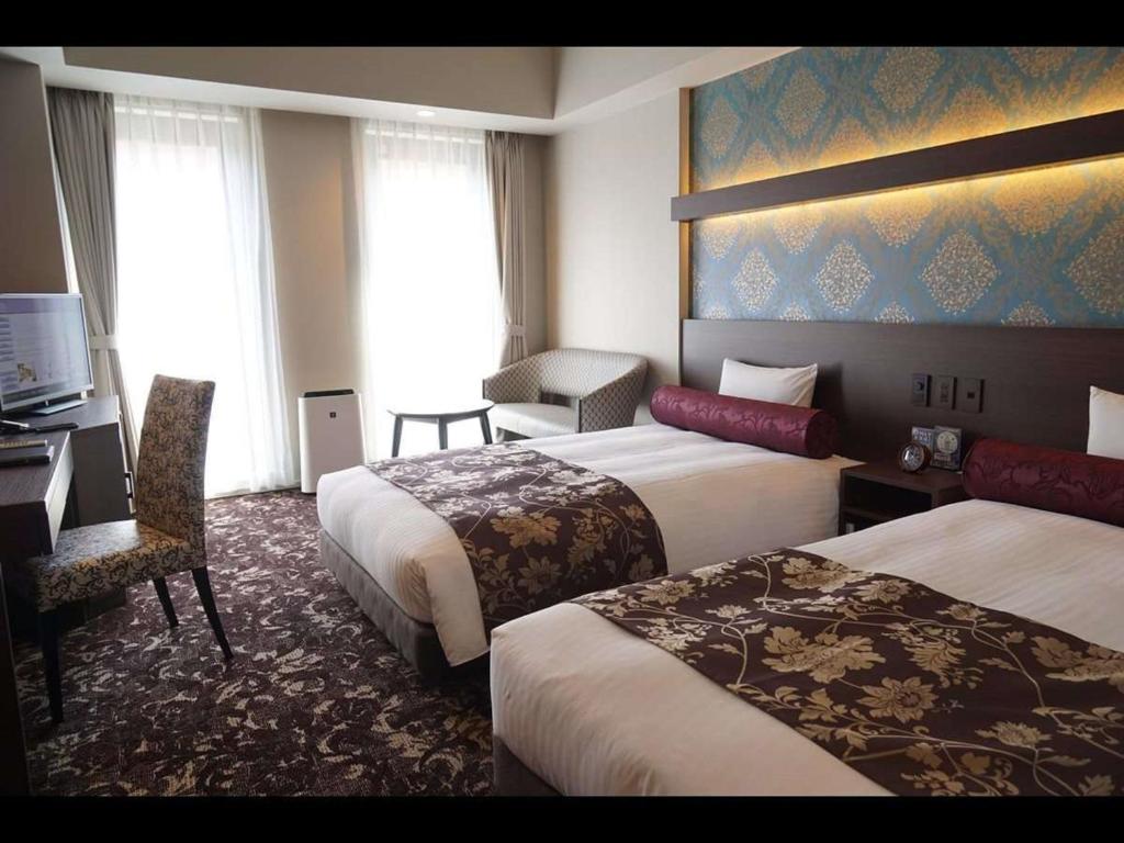 Posteľ alebo postele v izbe v ubytovaní Hotel WBF Sapporo Chuo