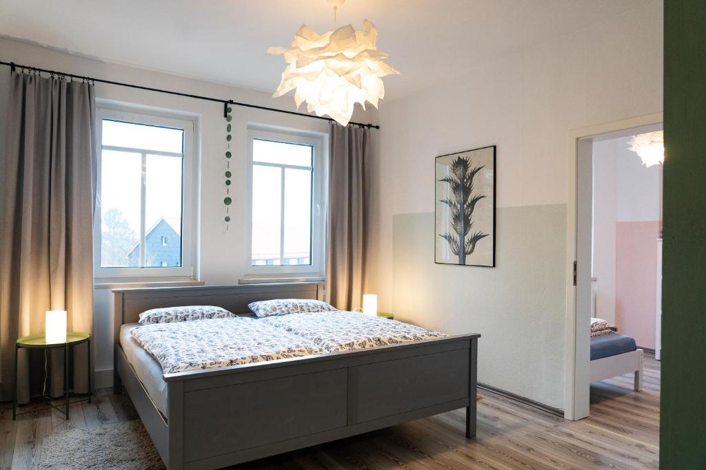 Postel nebo postele na pokoji v ubytování Harzquartier