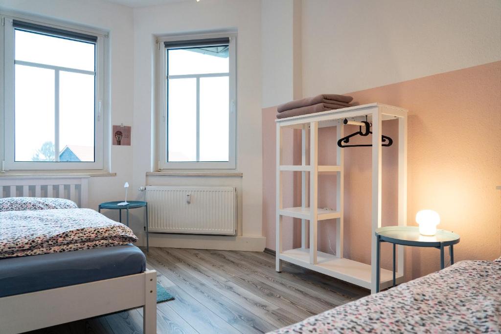Postel nebo postele na pokoji v ubytování Harzquartier