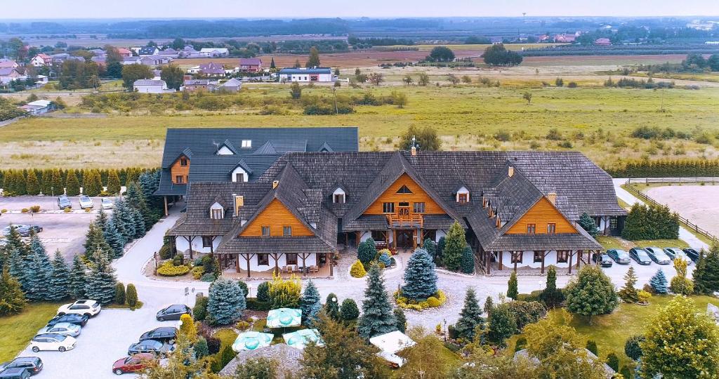 an aerial view of a large house with a yard at Rancho Pod Bocianem in Przypki