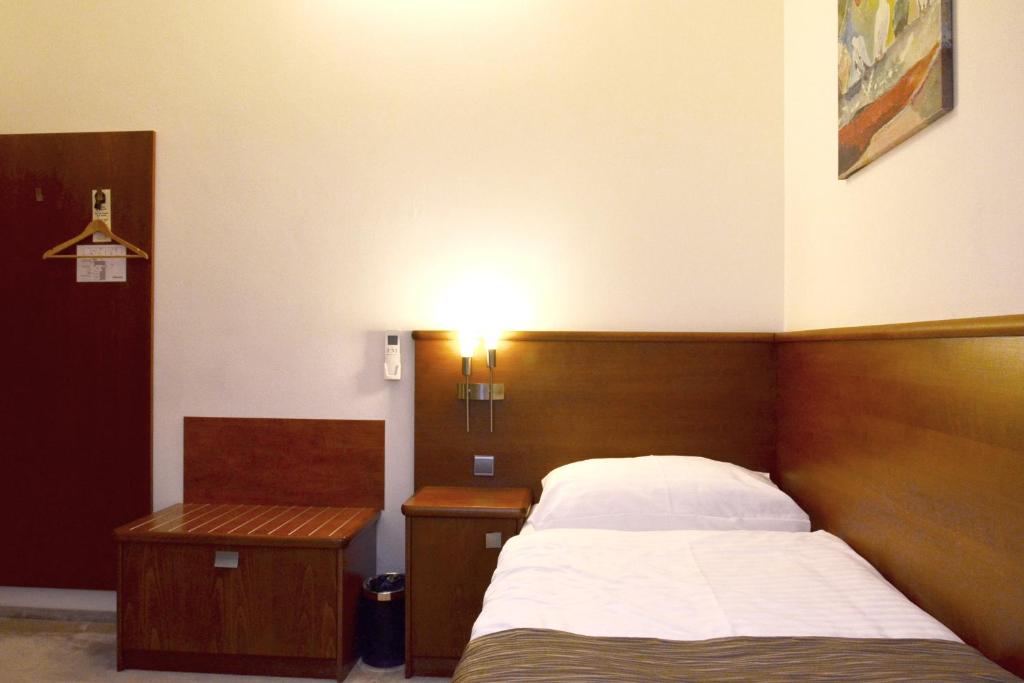 Postel nebo postele na pokoji v ubytování Penzion Integrity
