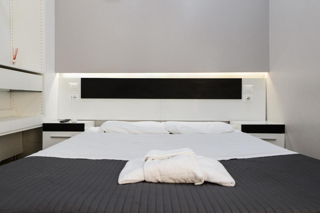 Cama ou camas em um quarto em Magenta Collection Purificazione 69