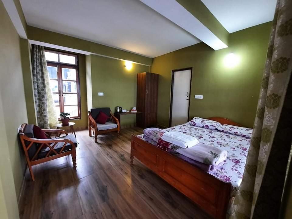 Postel nebo postele na pokoji v ubytování Kalimpong Sunrise-Inn Homestay