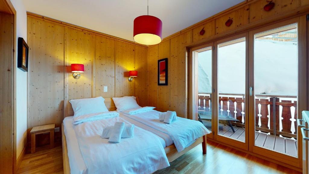Postel nebo postele na pokoji v ubytování Hauts de Veysonnaz SAUNA & VIEW apartments