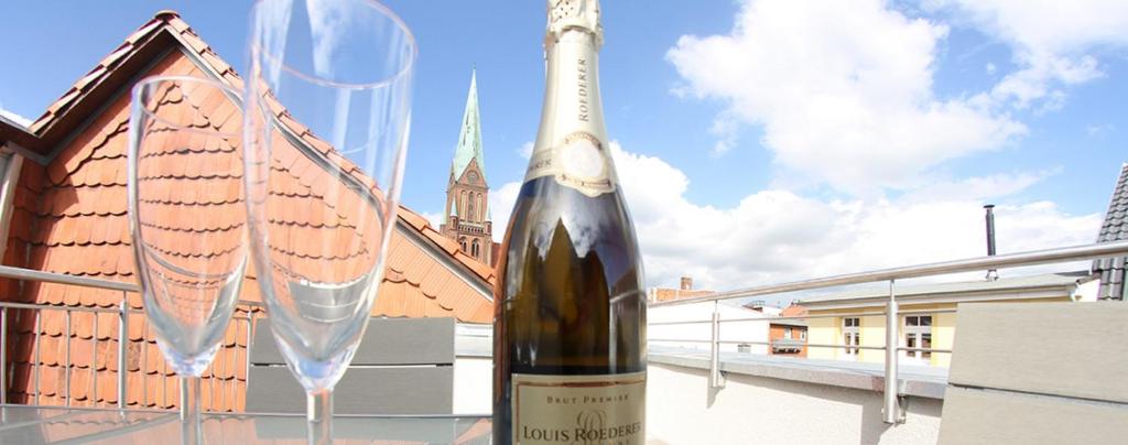 a bottle of wine sitting on top of a table at Domblick Schwerin in Schwerin