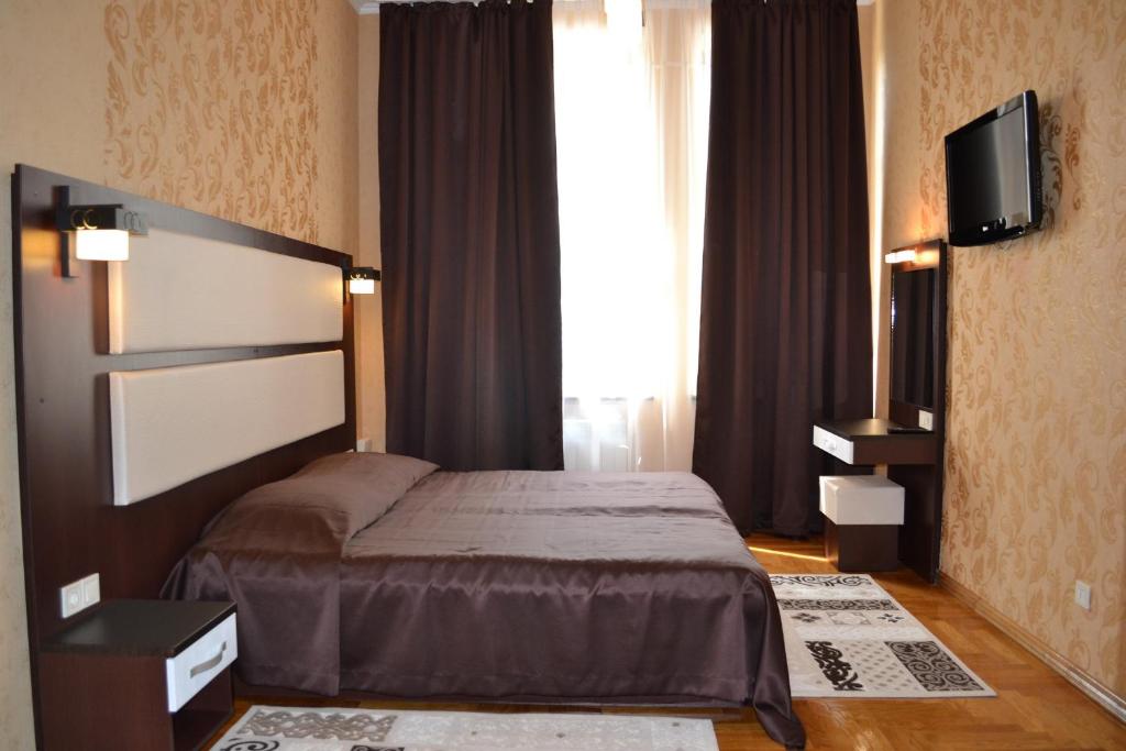 Postel nebo postele na pokoji v ubytování Hotel Star