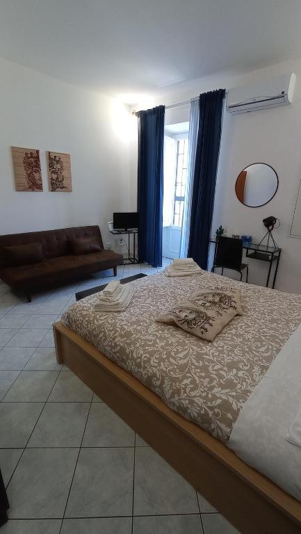 Łóżko lub łóżka w pokoju w obiekcie Casa Barocco Catania