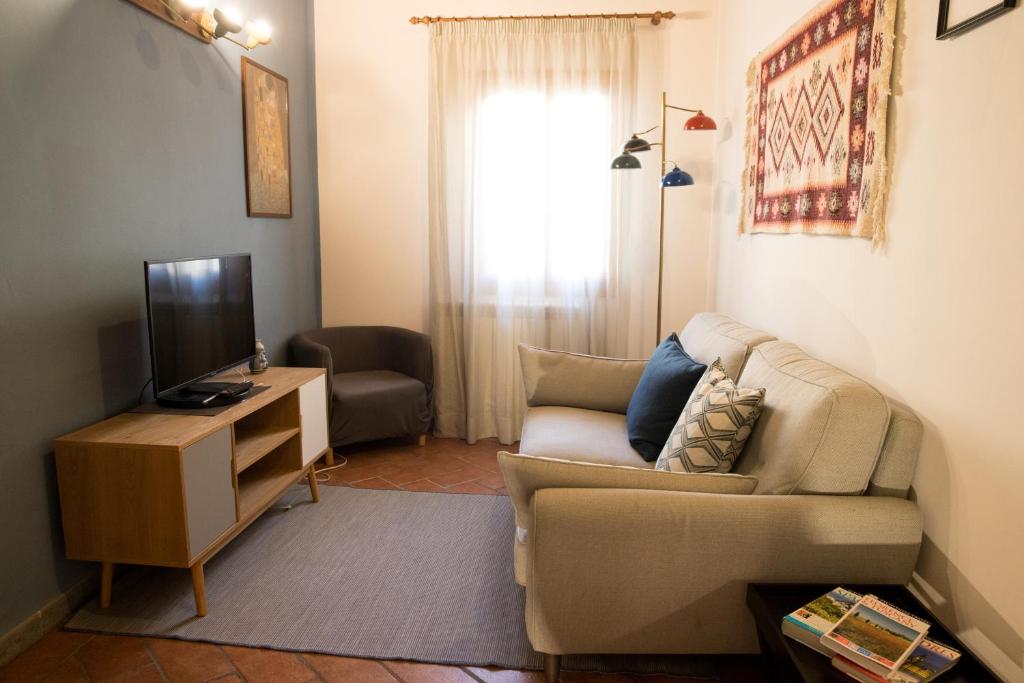 Telewizja i/lub zestaw kina domowego w obiekcie MEDICI CHAPELS TERRACE - VIEW APARTMENT