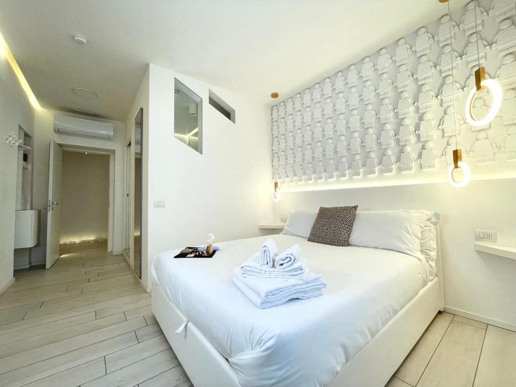 Posteľ alebo postele v izbe v ubytovaní Mariarosa Suites