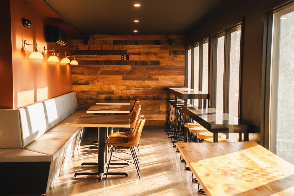 a row of tables and chairs in a restaurant at Waypoint Hotel in Bend