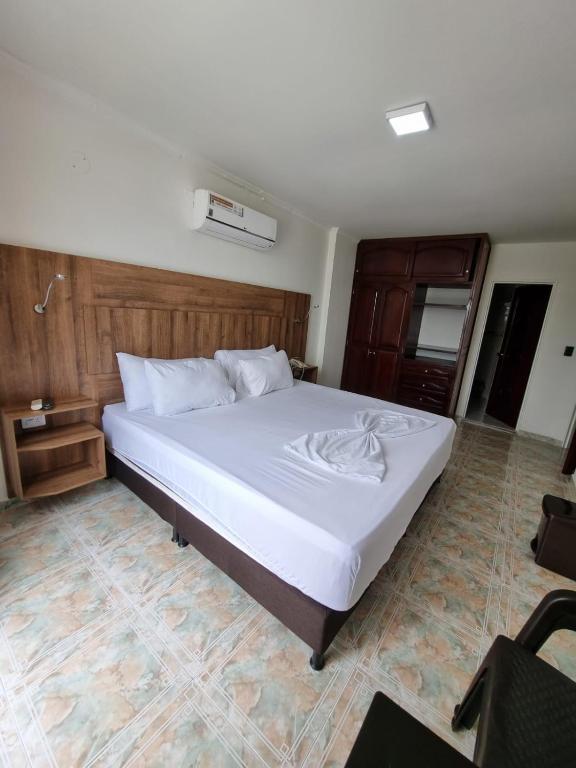 Postel nebo postele na pokoji v ubytování Zahira Hotel Melgar